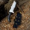 Survival combat knife in a premium leather sheath, ready for action.